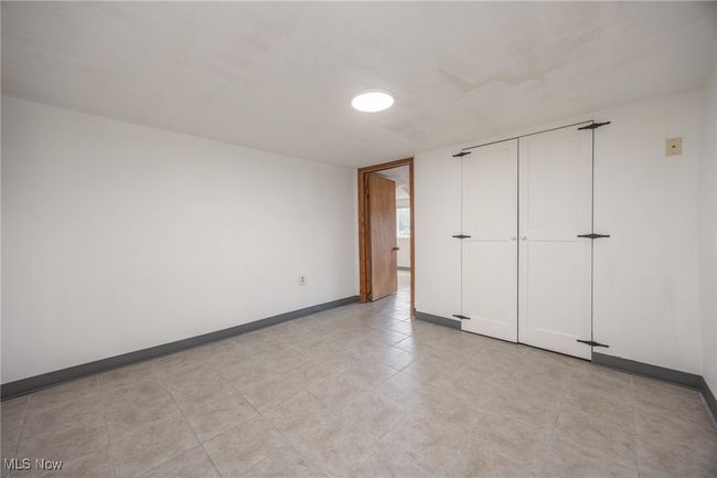 Unfurnished bedroom featuring baseboards | Image 25