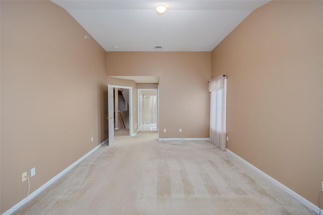 Empty room featuring light colored carpet and baseboards | Image 17