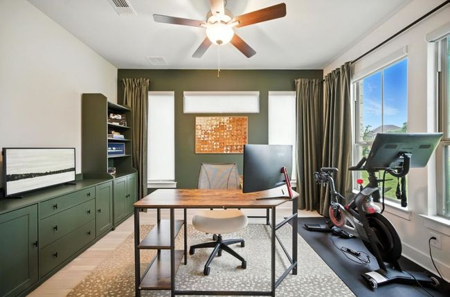 Office with ceiling fan and light wood-type flooring | Image 19