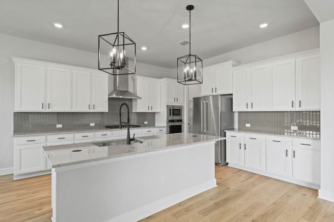 Beautiful, sleek cabinets with black iron hardware. | Image 4