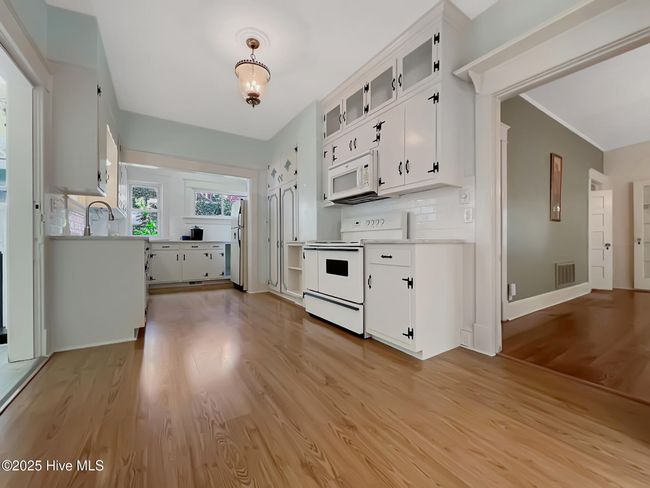 View of kitchen and adjoining dining room | Image 11