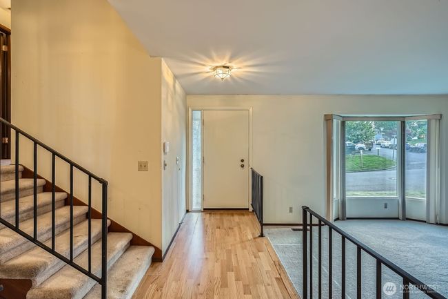 Entry to your new tri-level home in Des Moines! Step down living room to the right and stairs up to the bedrooms on your left. | Image 5