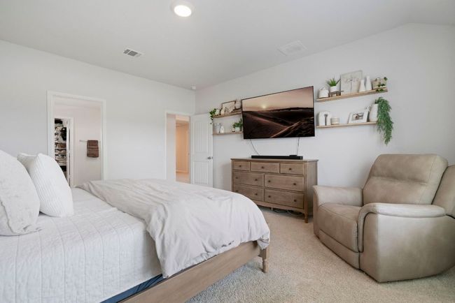 Bedroom featuring light carpet | Image 24