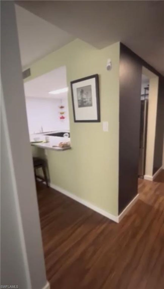 Hallway with wood finished floors | Image 9
