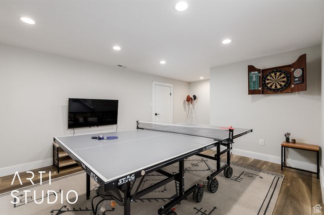 Rec room with visible vents, baseboards, wood finished floors, and recessed lighting | Image 26