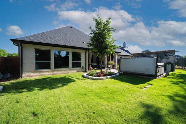 Back of property with a shingled roof and a patio area | Image 37