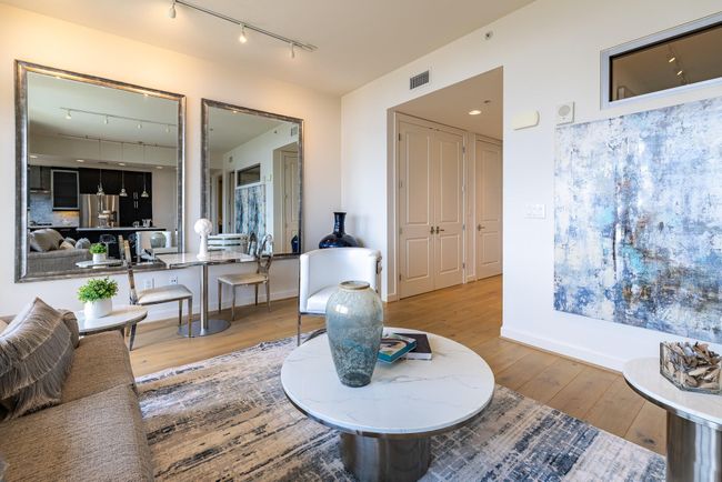 Open kitchen seamlessly flows into an inviting living area, perfect for entertaining. | Image 22