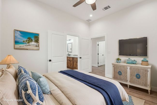 Bedroom with visible vents, recessed lighting, wood plank tile floor, and baseboards | Image 19