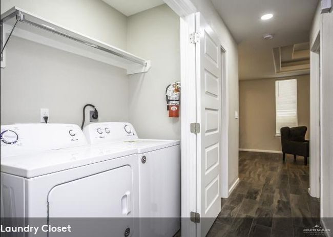 Washroom featuring baseboards, laundry area, recessed lighting, dark wood-style flooring, and washer and dryer | Image 6