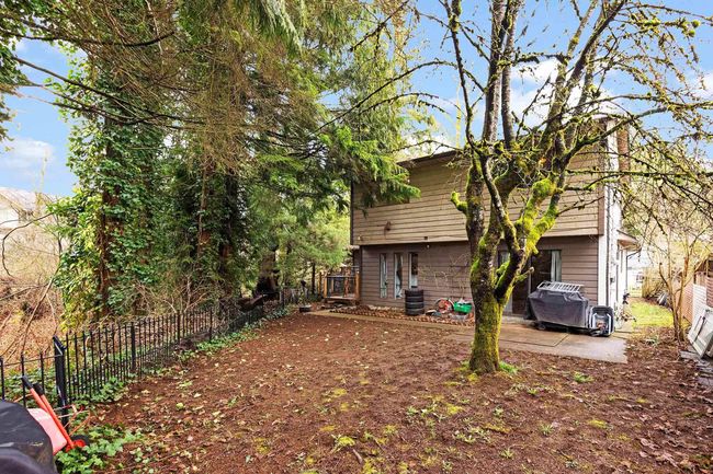 Fenced backyard featuring a patio area | Image 32