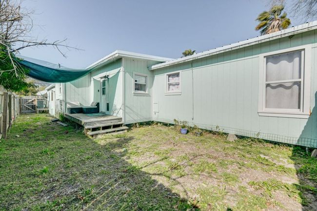 View of yard featuring a gate and fence | Image 28