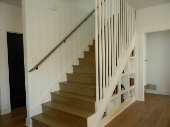 Stairway featuring visible vents, wood finished floors, and baseboards | Image 13