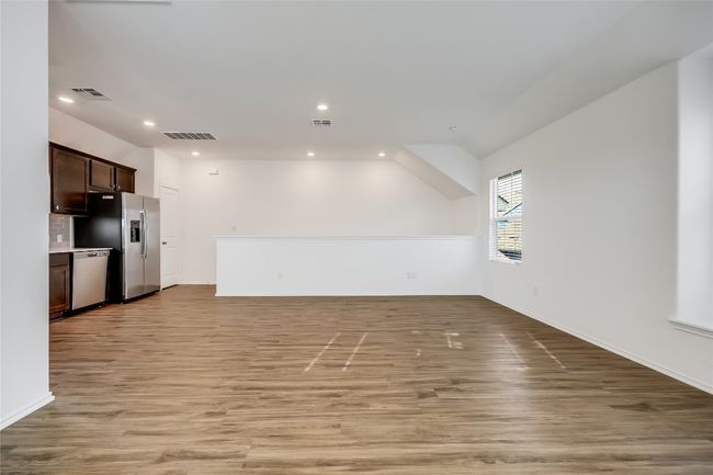 Garage apartment living room with recessed lighting and light wood-style flooring | Image 34