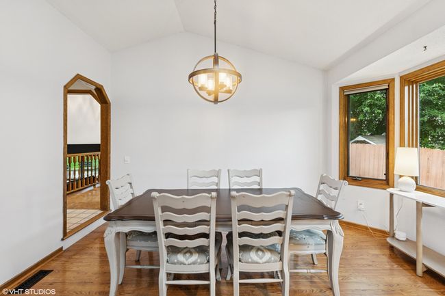 Sunlit formal dining room—great for hosting family dinners or dinner parties with friends | Image 10
