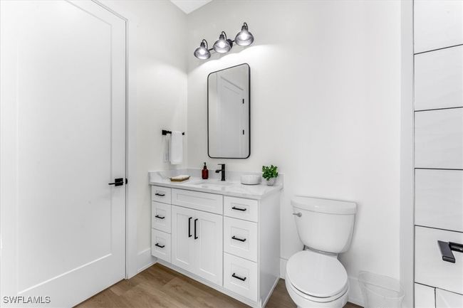 Bathroom featuring vanity and wood finished floors | Image 16