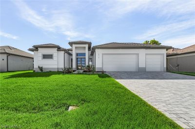 View of front of property with a garage and a front yard | Image 3