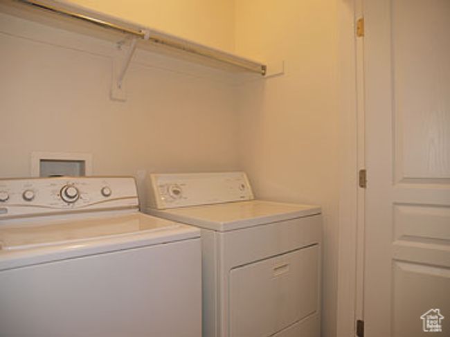 Clothes washing area with separate washer and dryer and laundry area | Image 11