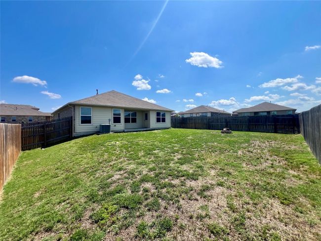 Rear view of house featuring central AC | Image 30