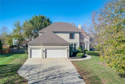 View of property with a garage and a front yard | Image 2