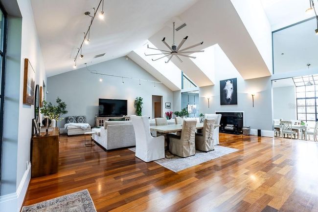 Bathed in natural daylight from three oversized skylights, this spacious Great Room creates an ideal setting for bright and inviting afternoon luncheons | Image 18