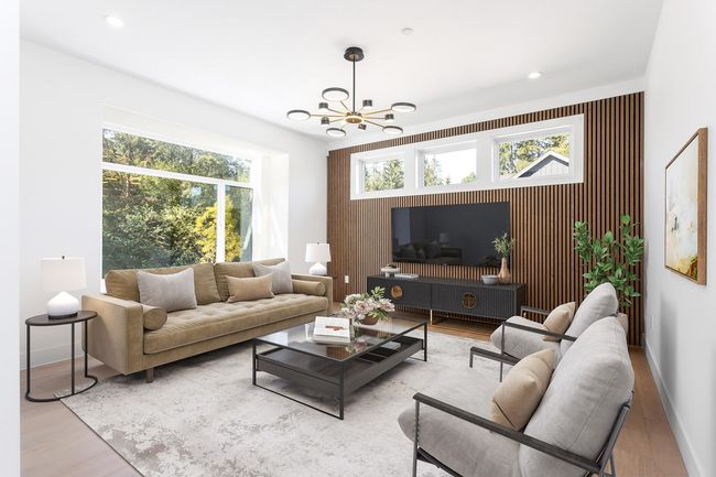 Living room featuring wood finished floors, recessed lighting, baseboards, a chandelier, and an accent wall | Image 6