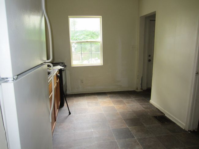 Kitchen accessible from backyard. | Image 6