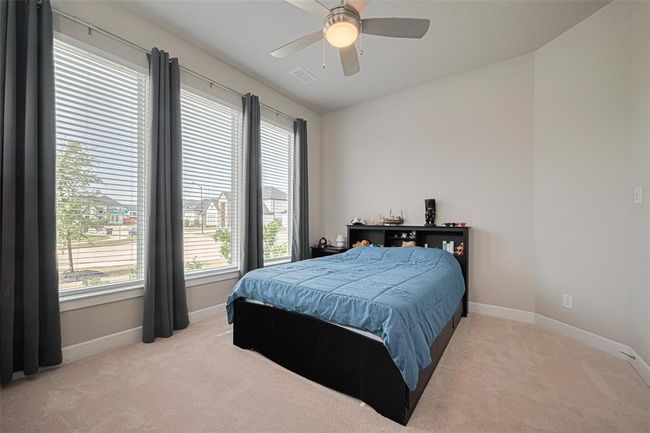 This is an additional downstairs room is a multi-generational suite currently used as a bedroom. | Image 25
