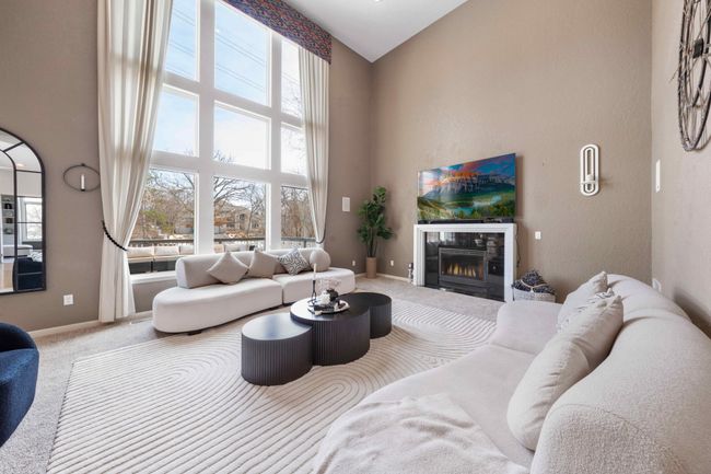 Family room has a gas fireplace | Image 26
