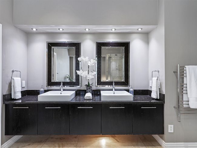 Full bath featuring double vanity, a towel warming rack, and tile patterned flooring | Image 26