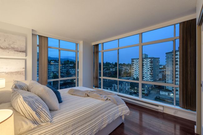 Bedroom with a city view, hardwood / wood-style floors, expansive windows, and a mountain view | Image 32