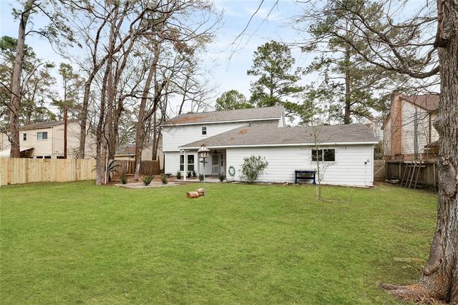 Enjoy a beautiful afternoon with your loved ones in this enormous private back yard, ideal for outdoor activities and relaxation. | Image 33
