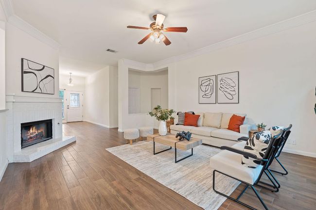 Inside, a A wide entry foyer flows seamlessly into the welcoming living room. | Image 8
