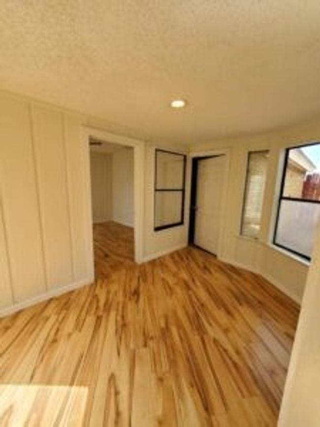 Unfurnished bedroom with light wood-type flooring, a closet, and recessed lighting | Image 40