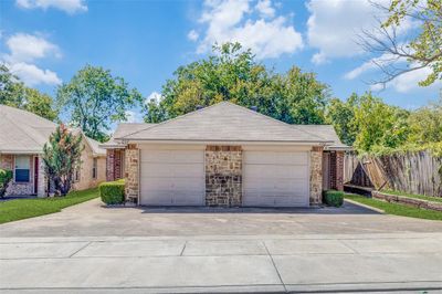 Ranch-style home with a garage | Image 1