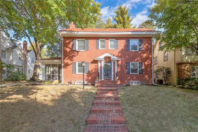 Renovated open concept kitchen with granite countertops, SS appliances (ALL STAY), and breakfast bar | Image 1