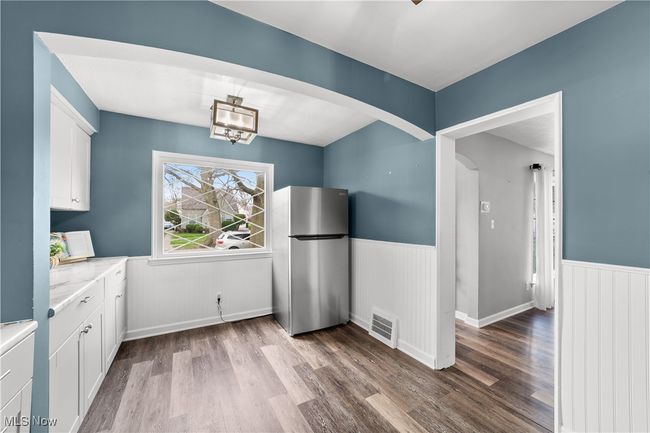 Sunny dining area with lots of storage in kitchen | Image 11