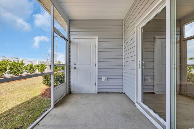 View of unfurnished sunroom | Image 16