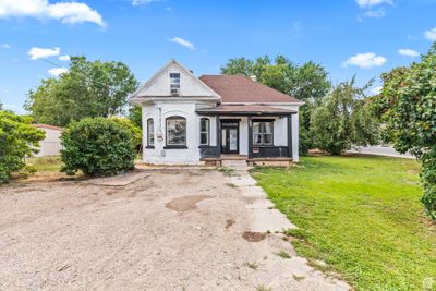 View of front of house featuring a front lawn and a porch | Image 1