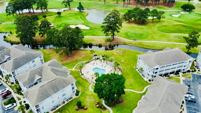 Bird's eye view of a large body of water and a golf club | Image 27