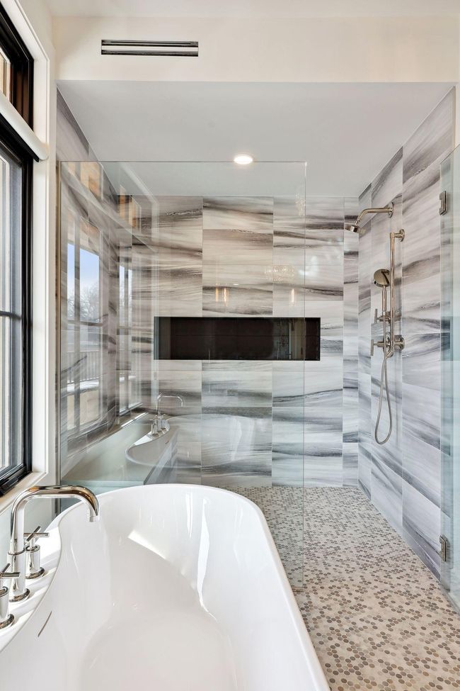 Soak the stress of the day away in the large tub or the spacious shower with dual shower heads | Image 21