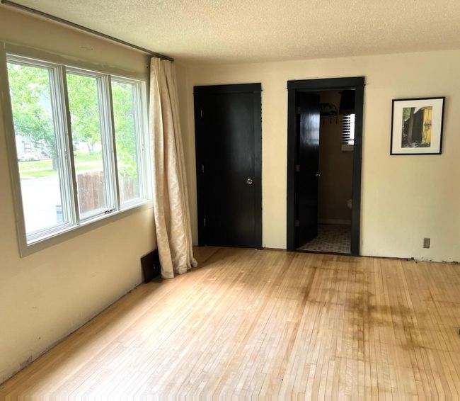 The other half of the living room. Again, look at the beautiful flooring. there are vaulted ceilings and fresh paint. | Image 8