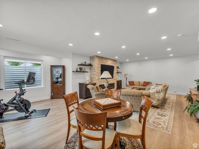 Dining room featuring light wood-type flooring, baseboards, and recessed lighting | Image 32
