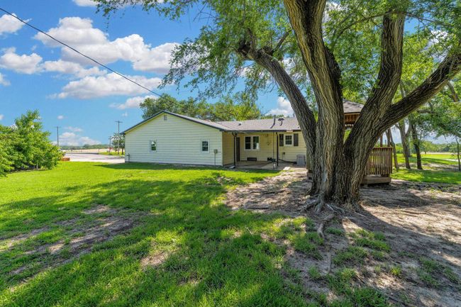 Rear view of property featuring a yard | Image 29