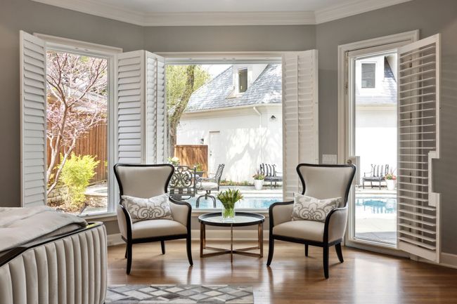 First floor primary with sitting area and views of the pool | Image 12