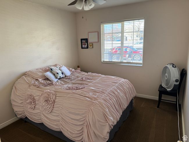 Bedroom featuring a ceiling fan, carpet floors, and baseboards | Image 11