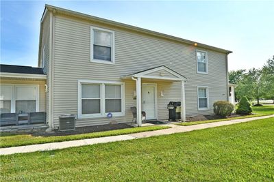 View of front of home featuring central AC and a front lawn | Image 1