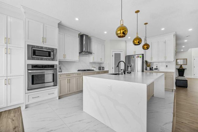 316 Kinniburgh Link, House other with 5 bedrooms, 4 bathrooms and 6 parking in Chestermere AB | Image 15