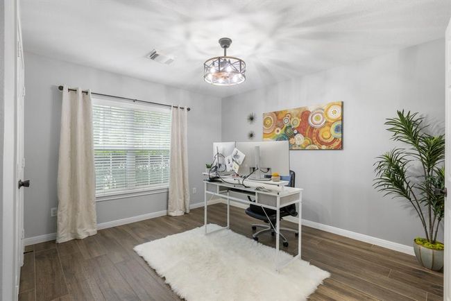 This second bedroom features a ceiling fan, walk in closet and tile floors. | Image 31