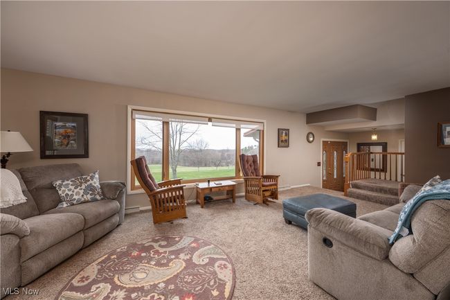 Living room featuring baseboards and carpet flooring | Image 16