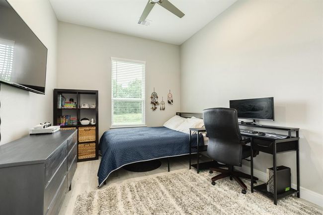 Third bedroom features awindow and ceiling fan. | Image 26